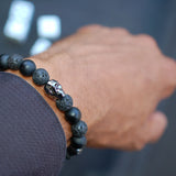 Stretch-band black Swarovski crystal skull bracelet with black Onyx beads and Lava beads.